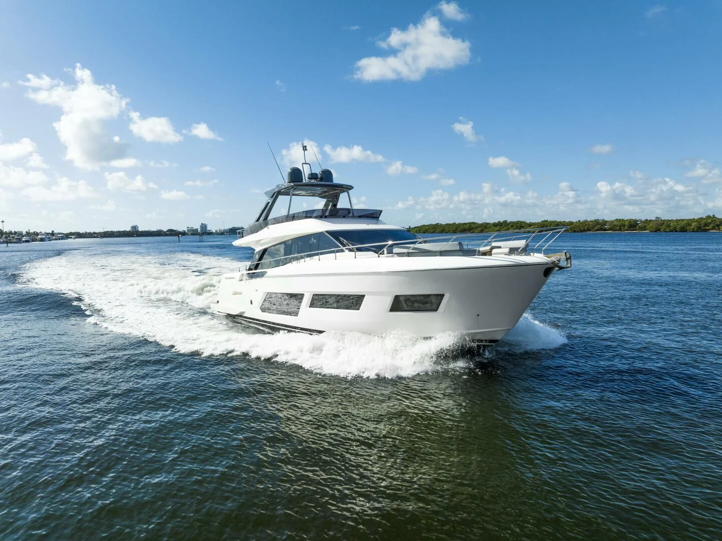 a white yacht on the water aboard LEGEND Yacht for Sale