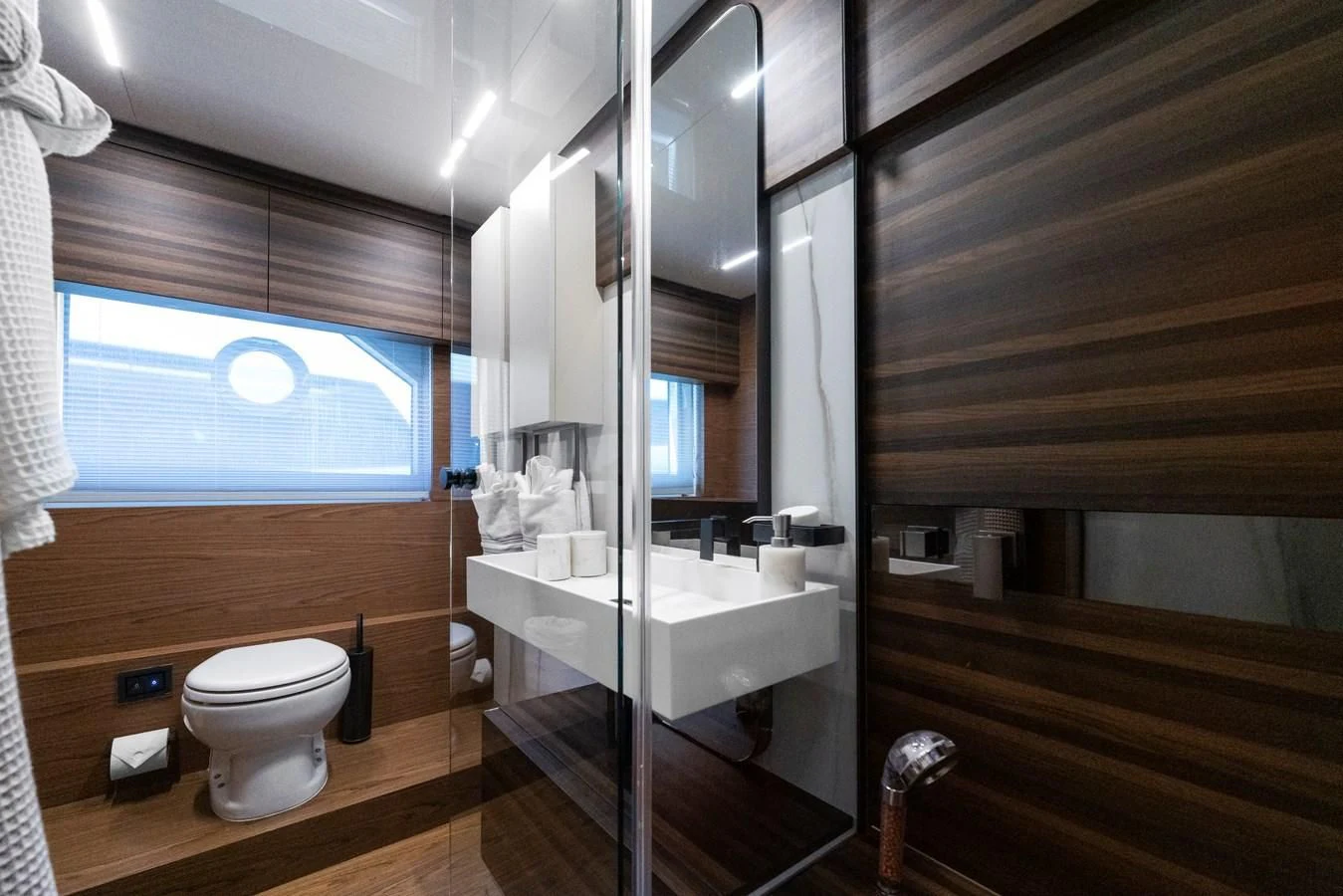 a bathroom with a large mirror aboard LEGEND Yacht for Sale