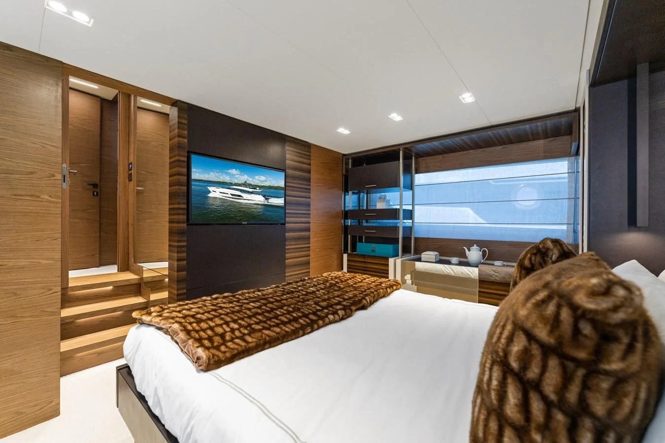 a room with a tv and a bed aboard LEGEND Yacht for Sale