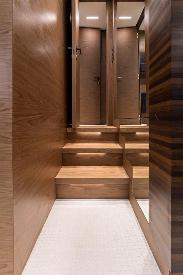 a hallway with wooden doors aboard LEGEND Yacht for Sale