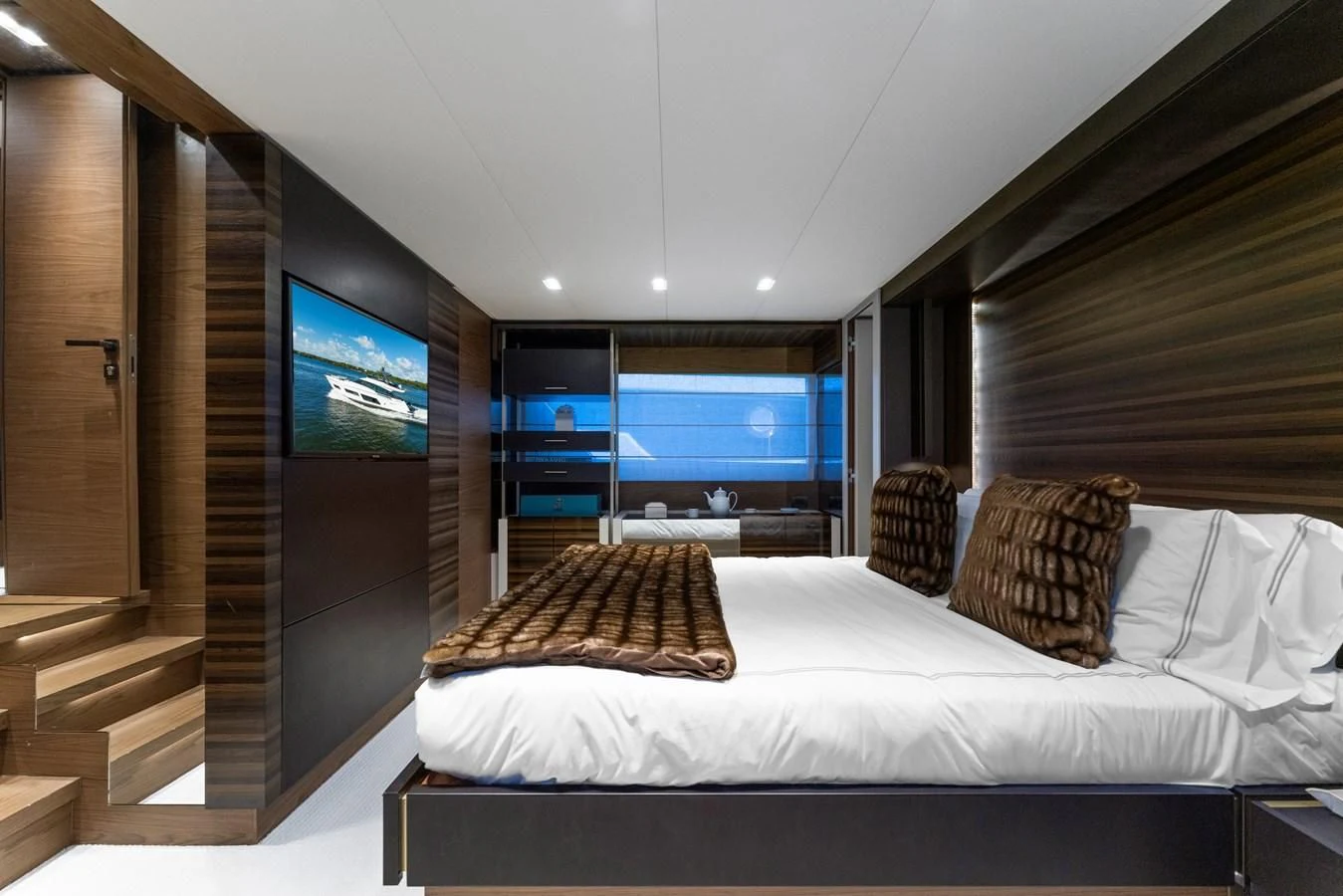a bedroom with a large bed aboard LEGEND Yacht for Sale