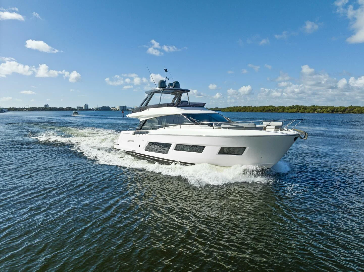 a white boat on water aboard LEGEND Yacht for Sale