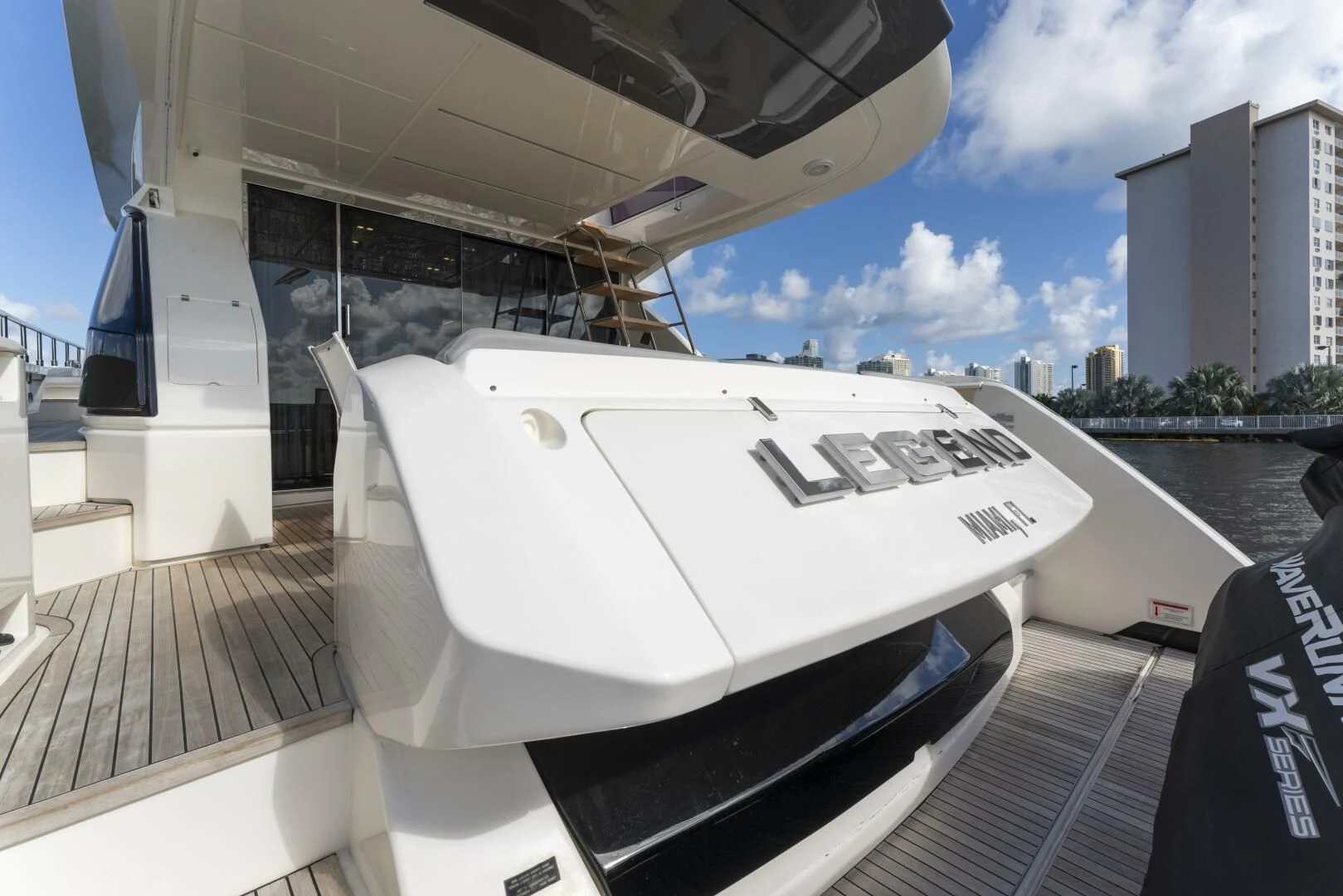 a white yacht on a dock aboard LEGEND Yacht for Sale