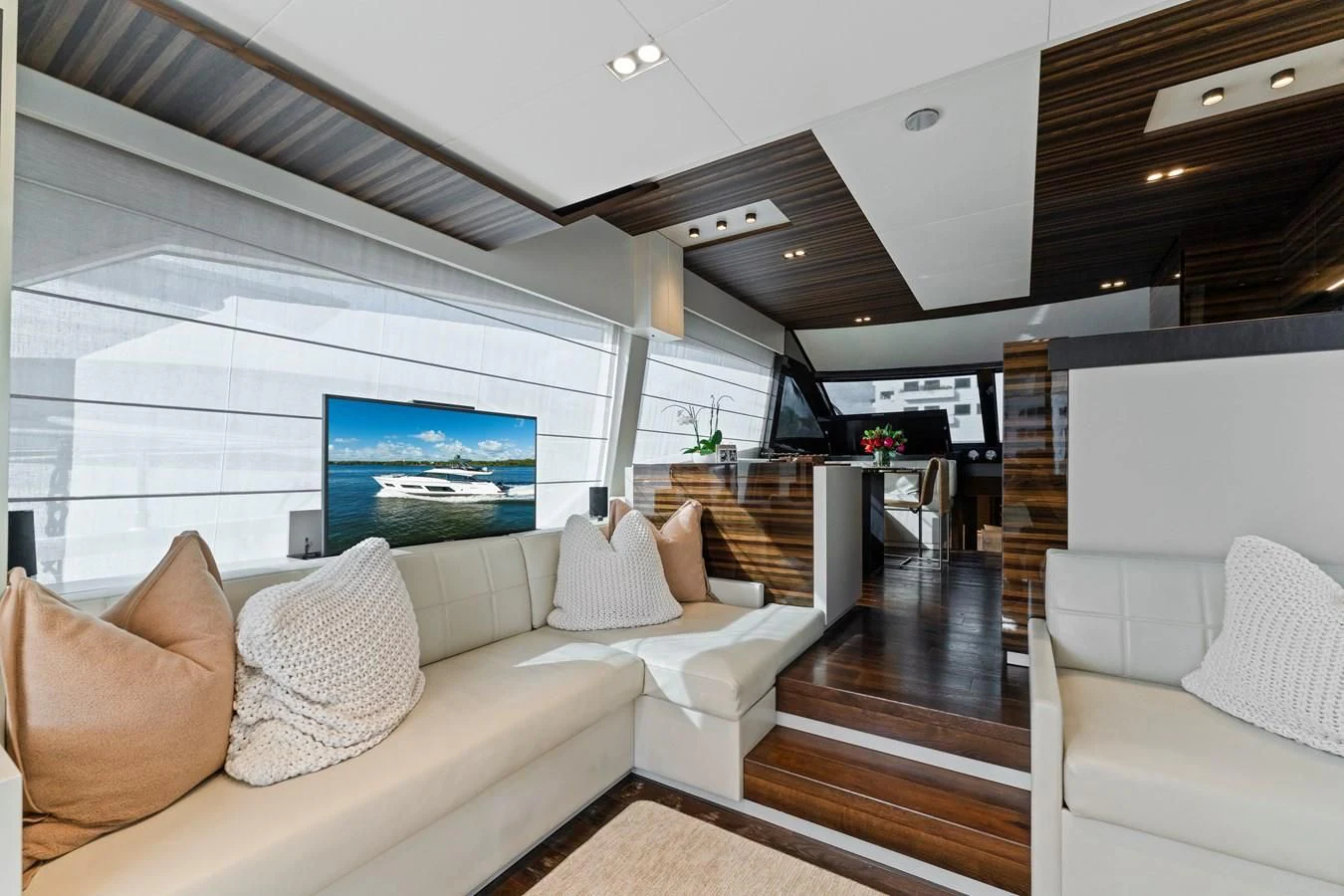 a living room with a large window aboard LEGEND Yacht for Sale