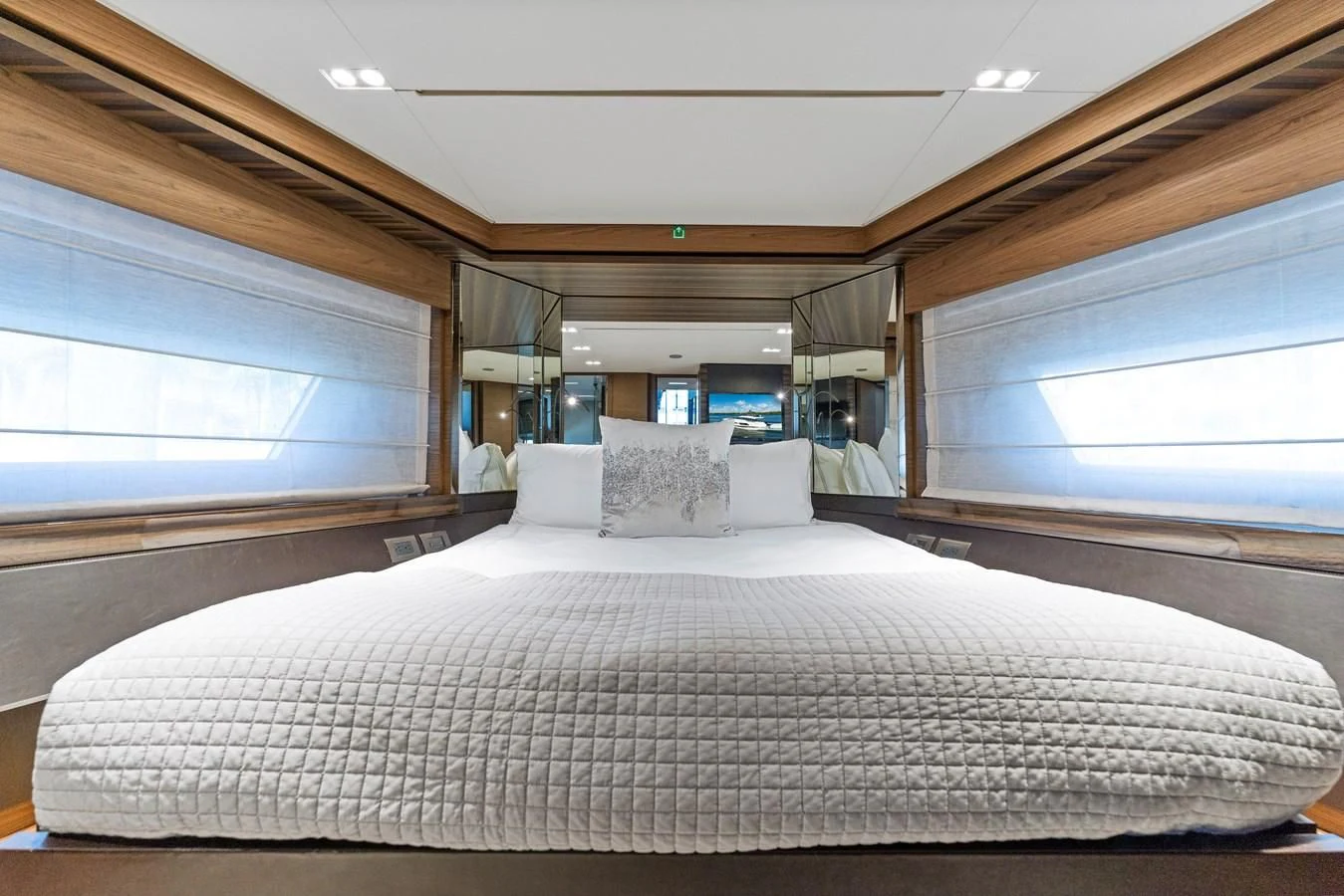 a bed with white sheets aboard LEGEND Yacht for Sale