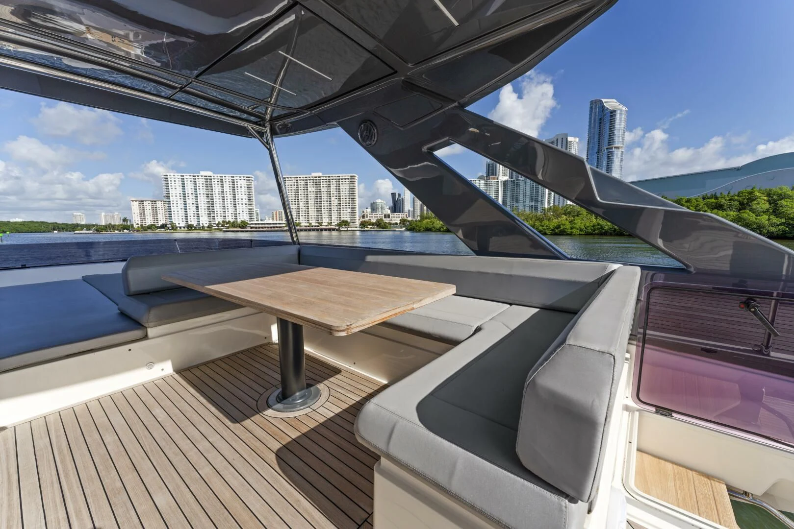 a deck with a view of a city and water aboard LEGEND Yacht for Sale