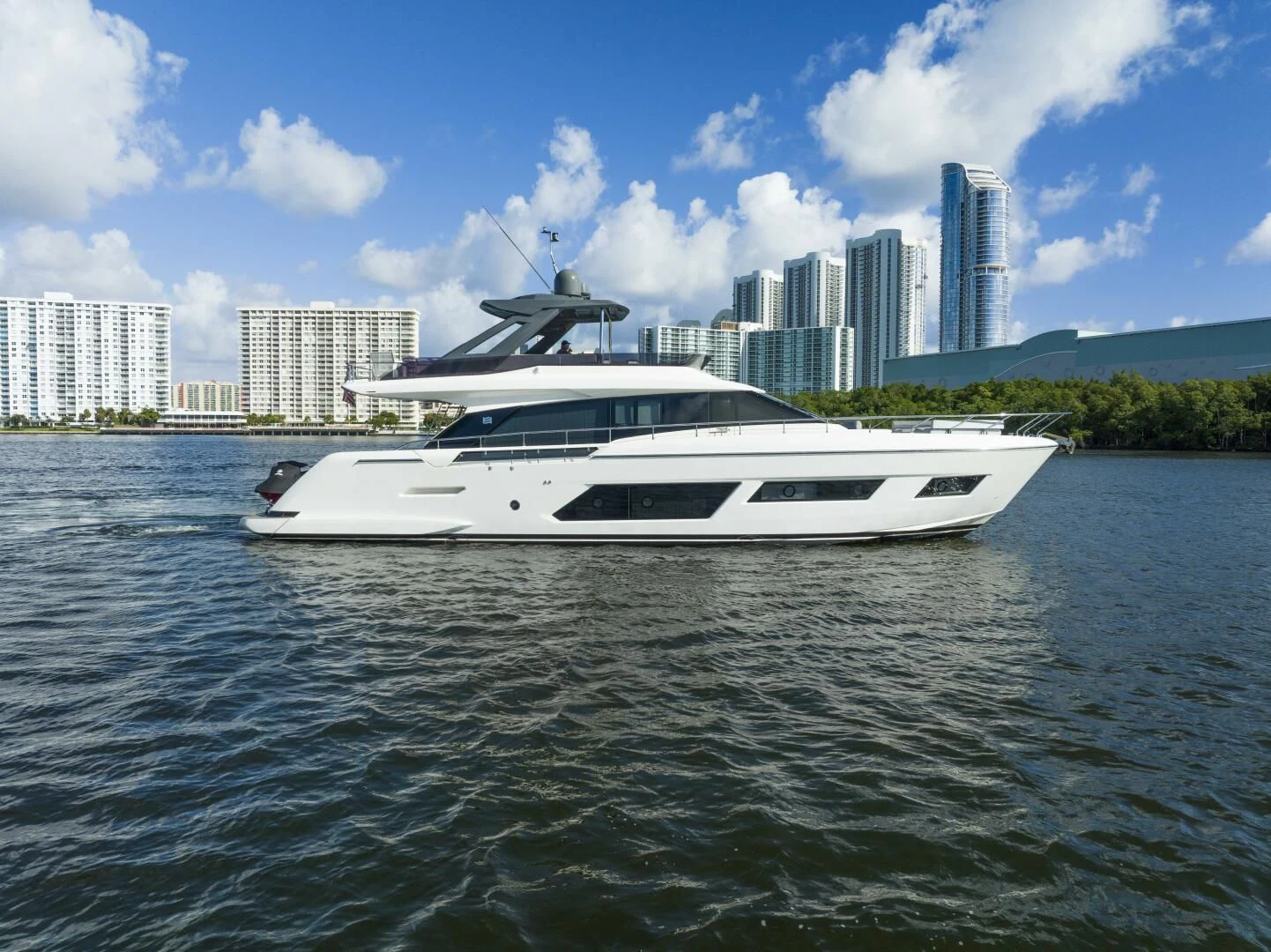 a white yacht on the water aboard LEGEND Yacht for Sale