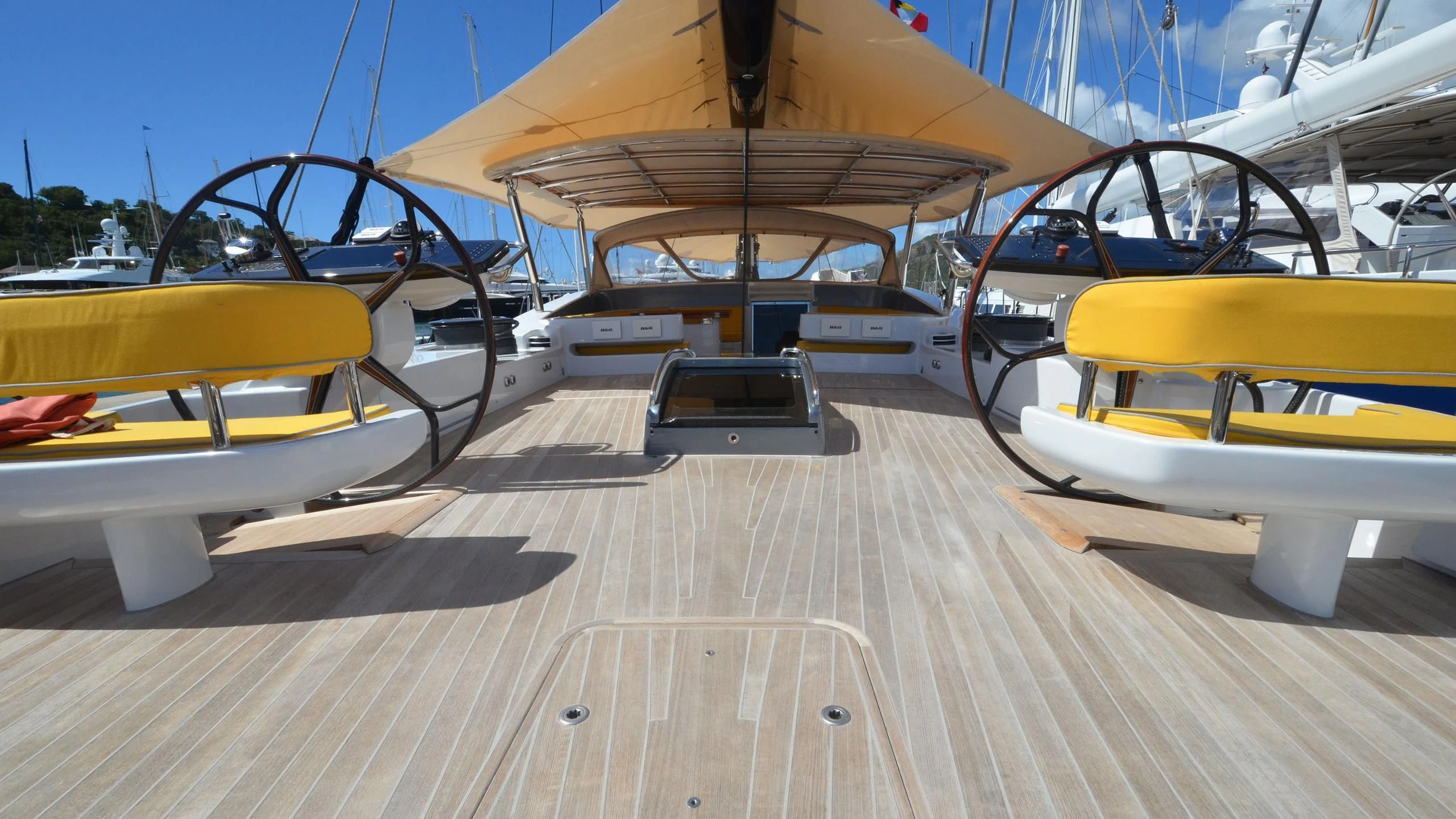 a row of yellow and white boats aboard DANNESKJOLD Yacht for Sale