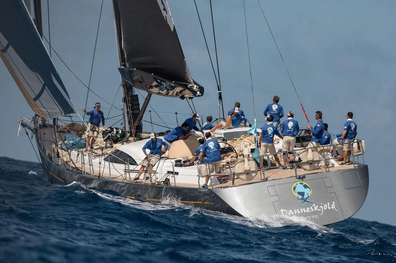 a group of people on a sailboat aboard DANNESKJOLD Yacht for Sale