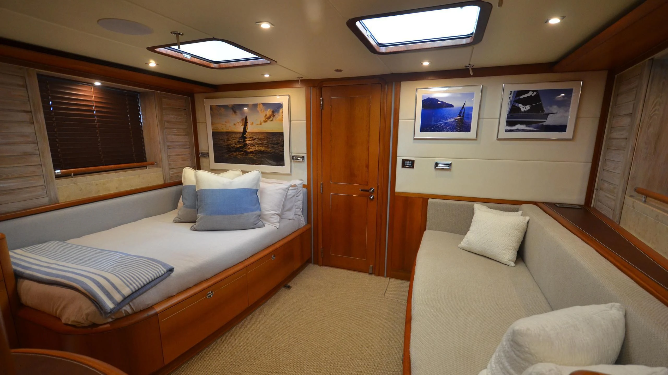 a room with a bed and a couch aboard DANNESKJOLD Yacht for Sale