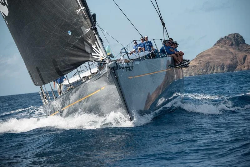 a group of people on a sailboat in the water aboard DANNESKJOLD Yacht for Sale
