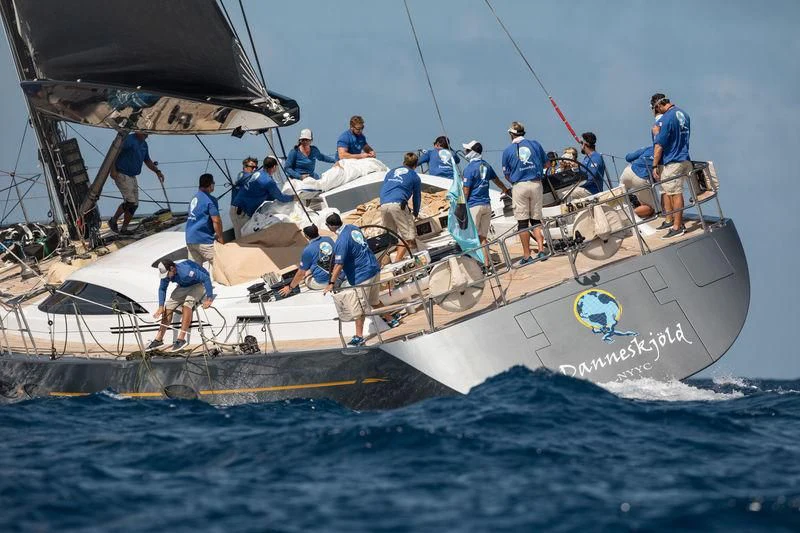 a group of people on a boat aboard DANNESKJOLD Yacht for Sale