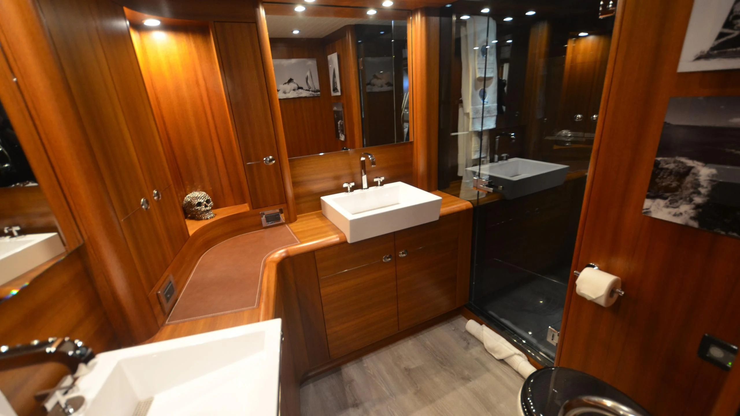 a bathroom with wooden cabinets aboard DANNESKJOLD Yacht for Sale