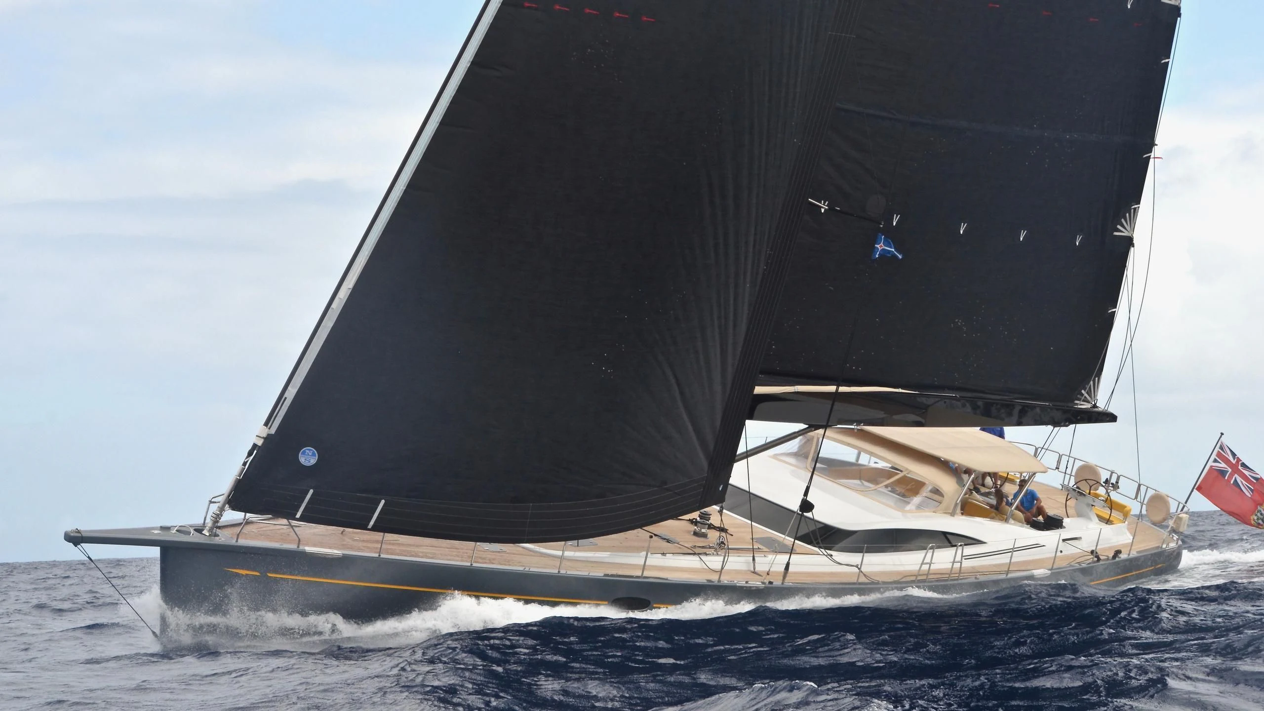 a large black and white sailboat on the water aboard DANNESKJOLD Yacht for Sale