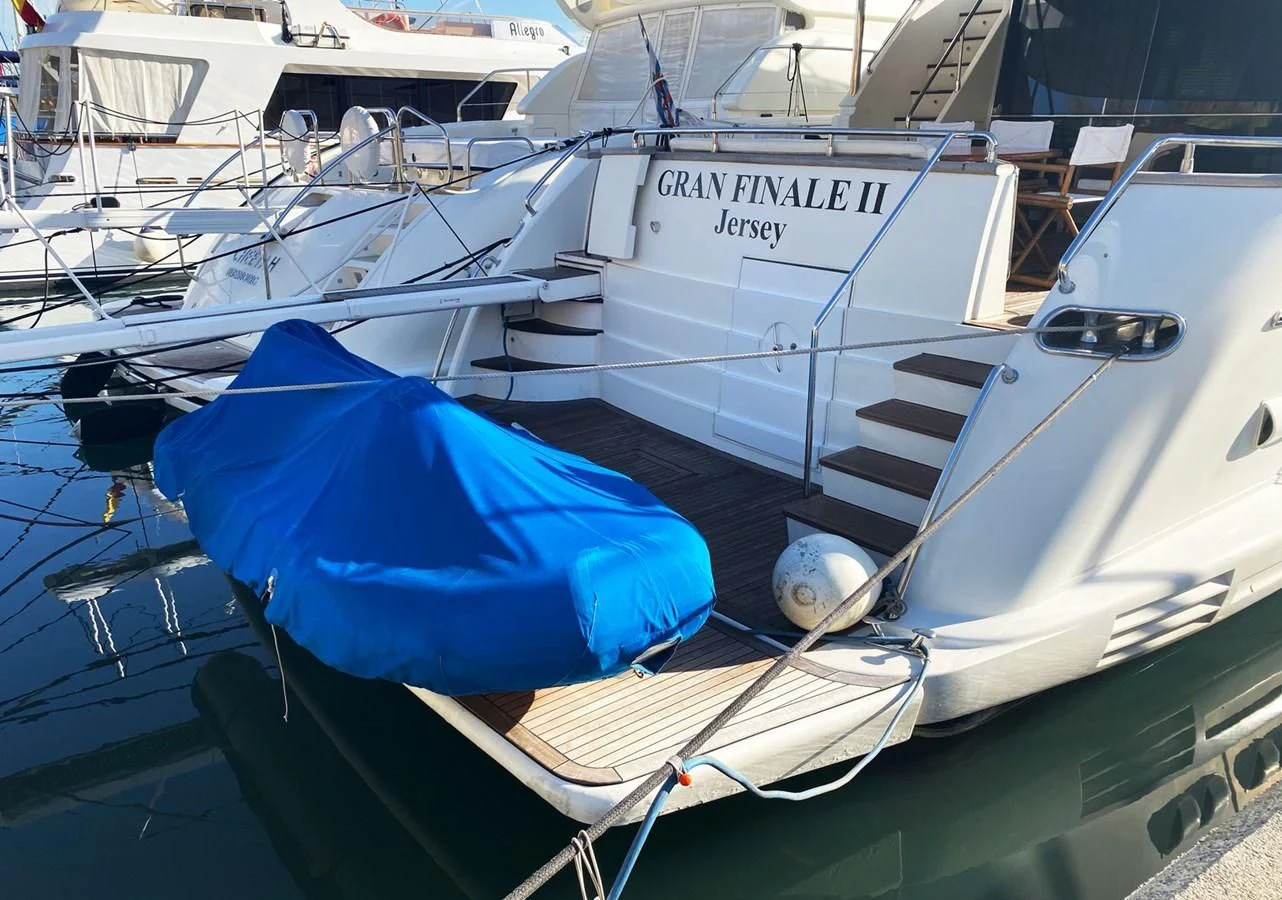 a boat is parked in a harbor aboard GRAN FINALE II Yacht for Sale