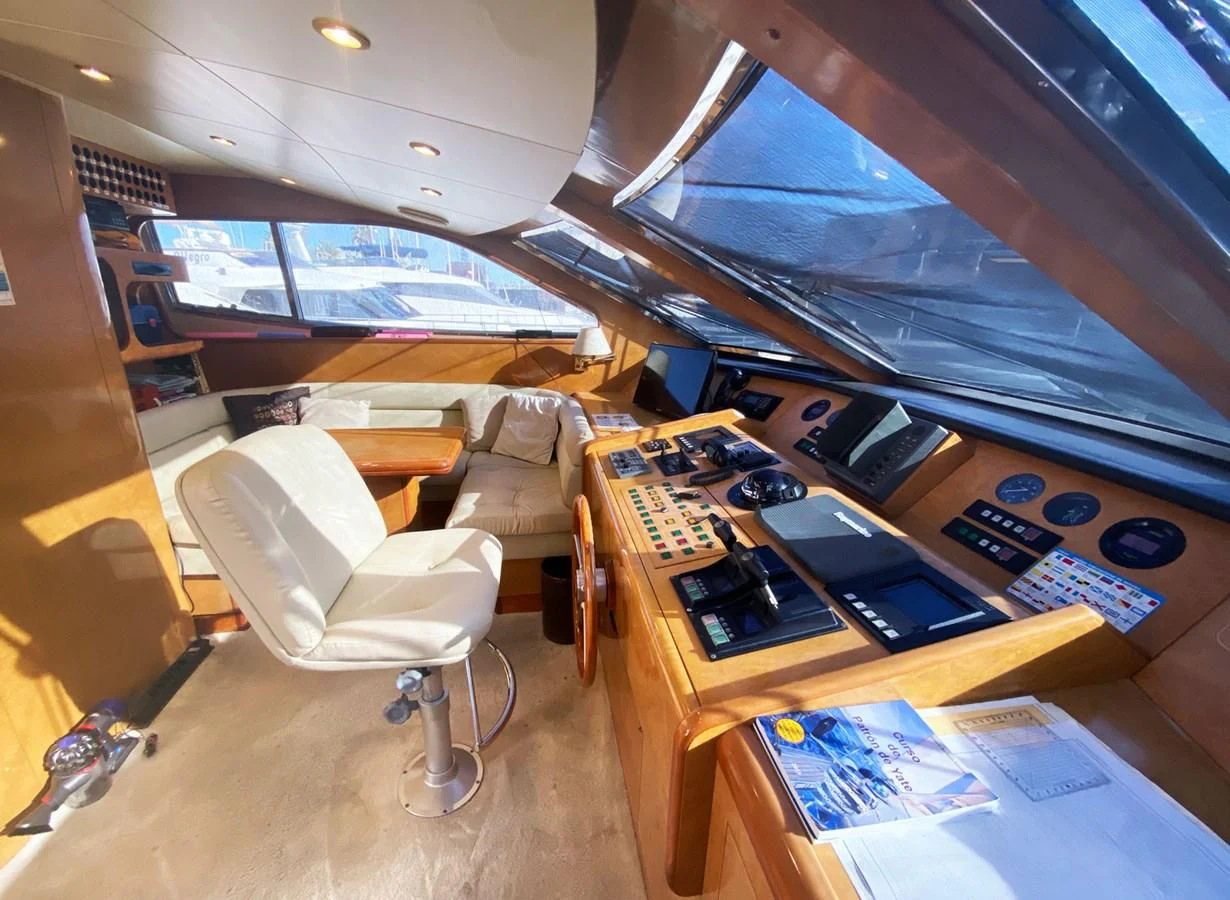 a room with a desk and chairs aboard GRAN FINALE II Yacht for Sale