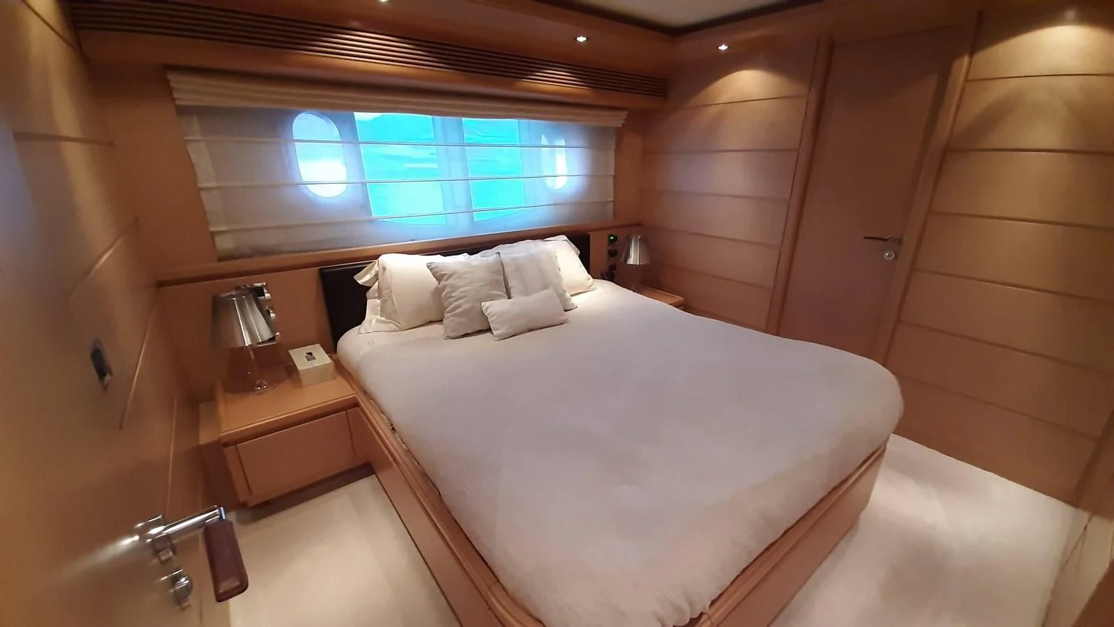 a bed in a room aboard OKAMI Yacht for Sale