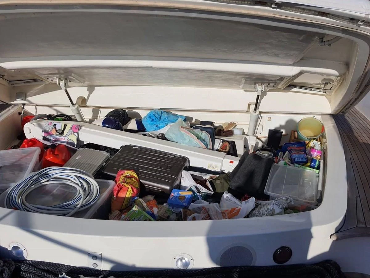 a car trunk full of items aboard OKAMI Yacht for Sale