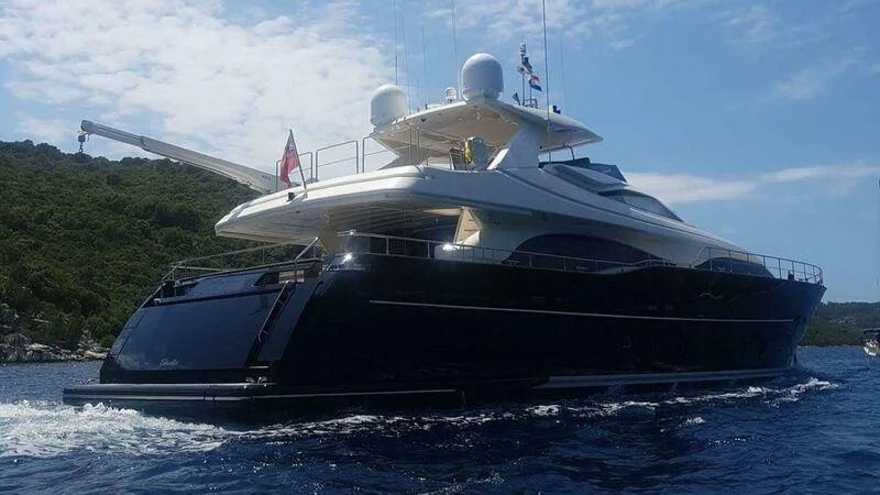 a large ship in the water aboard OKAMI Yacht for Sale