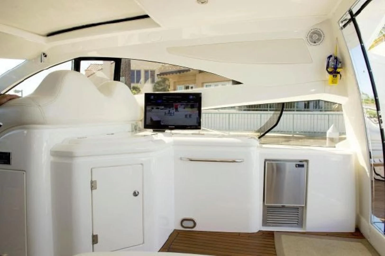 a white car inside a car aboard SONSEEKER Yacht for Sale