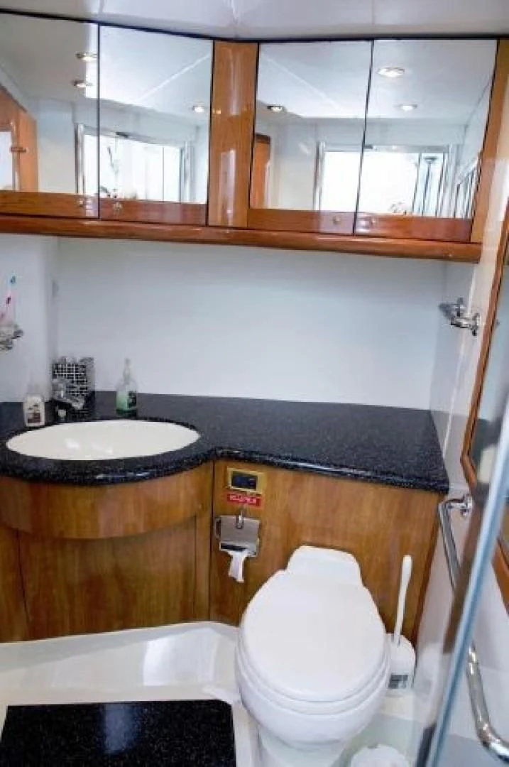 a bathroom with a sink and a toilet aboard SONSEEKER Yacht for Sale