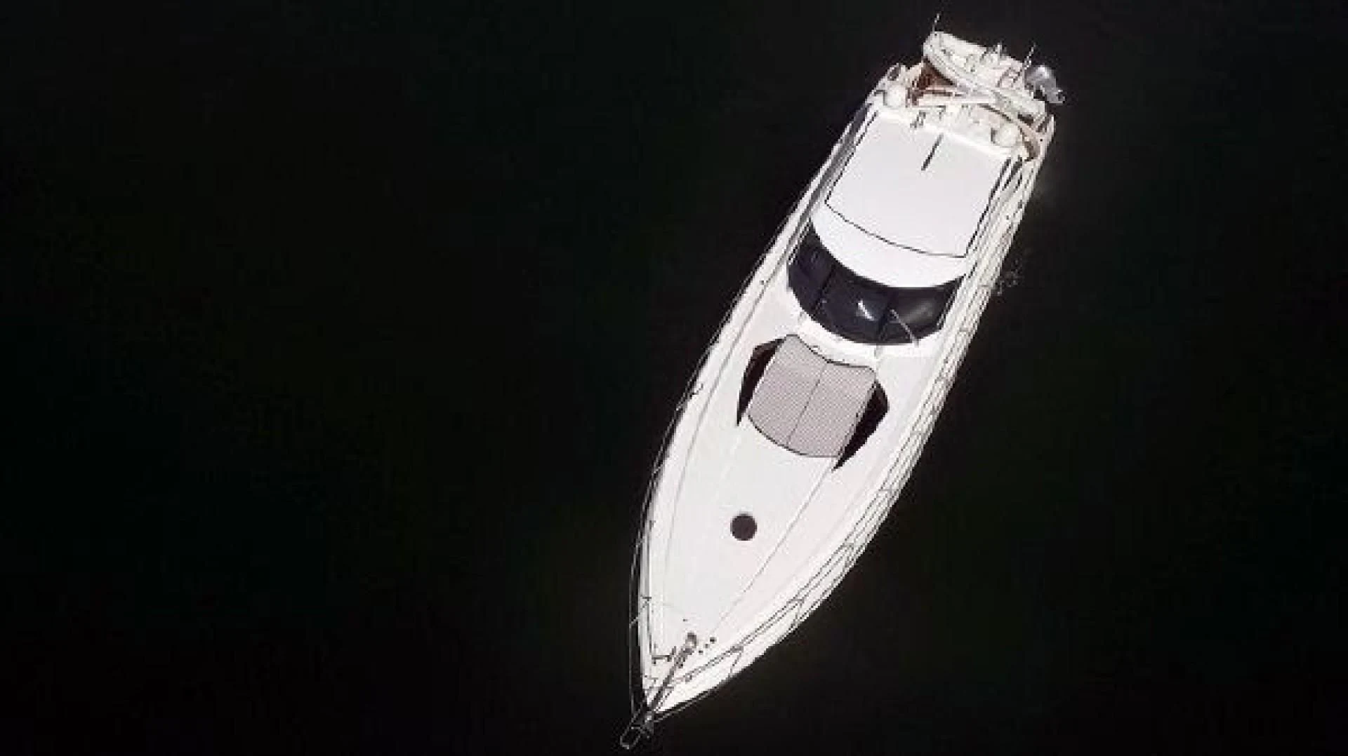 a white boat in the water aboard SONSEEKER Yacht for Sale