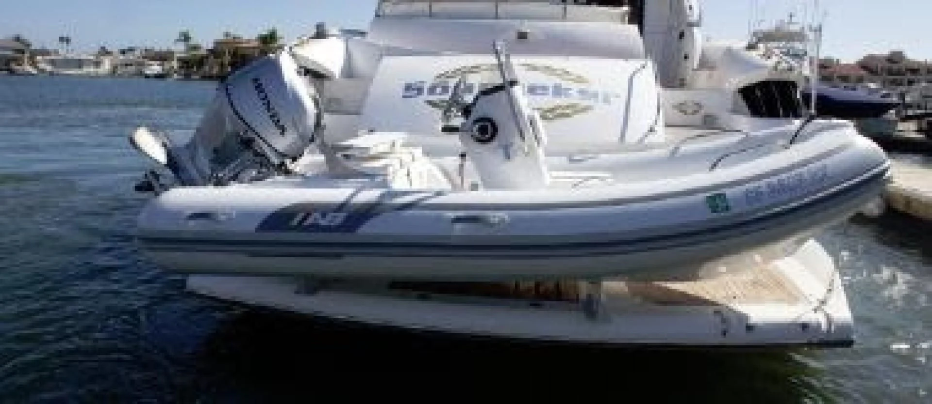 a white boat in the water aboard SONSEEKER Yacht for Sale