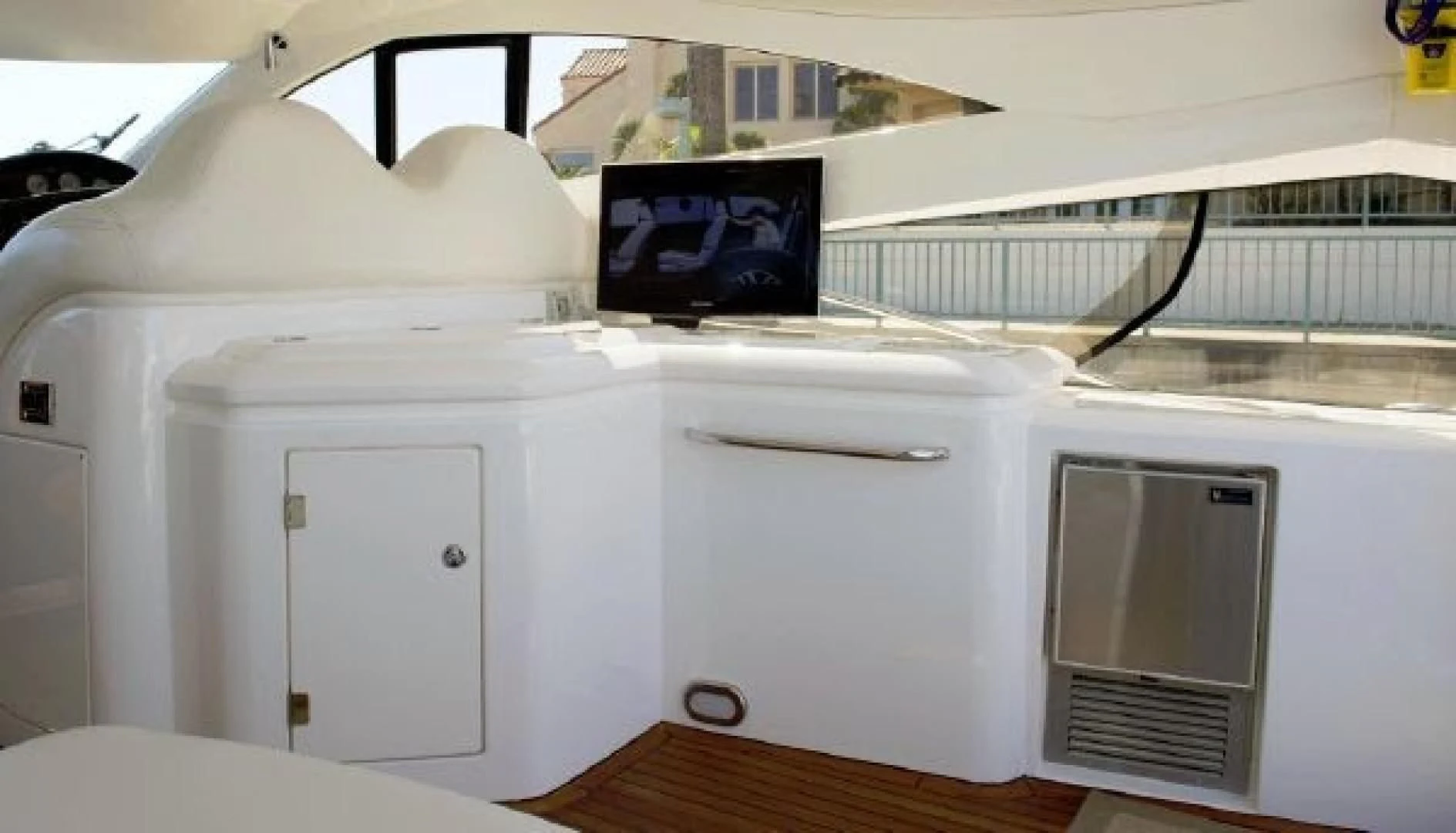 a white cabinet with a vent aboard SONSEEKER Yacht for Sale