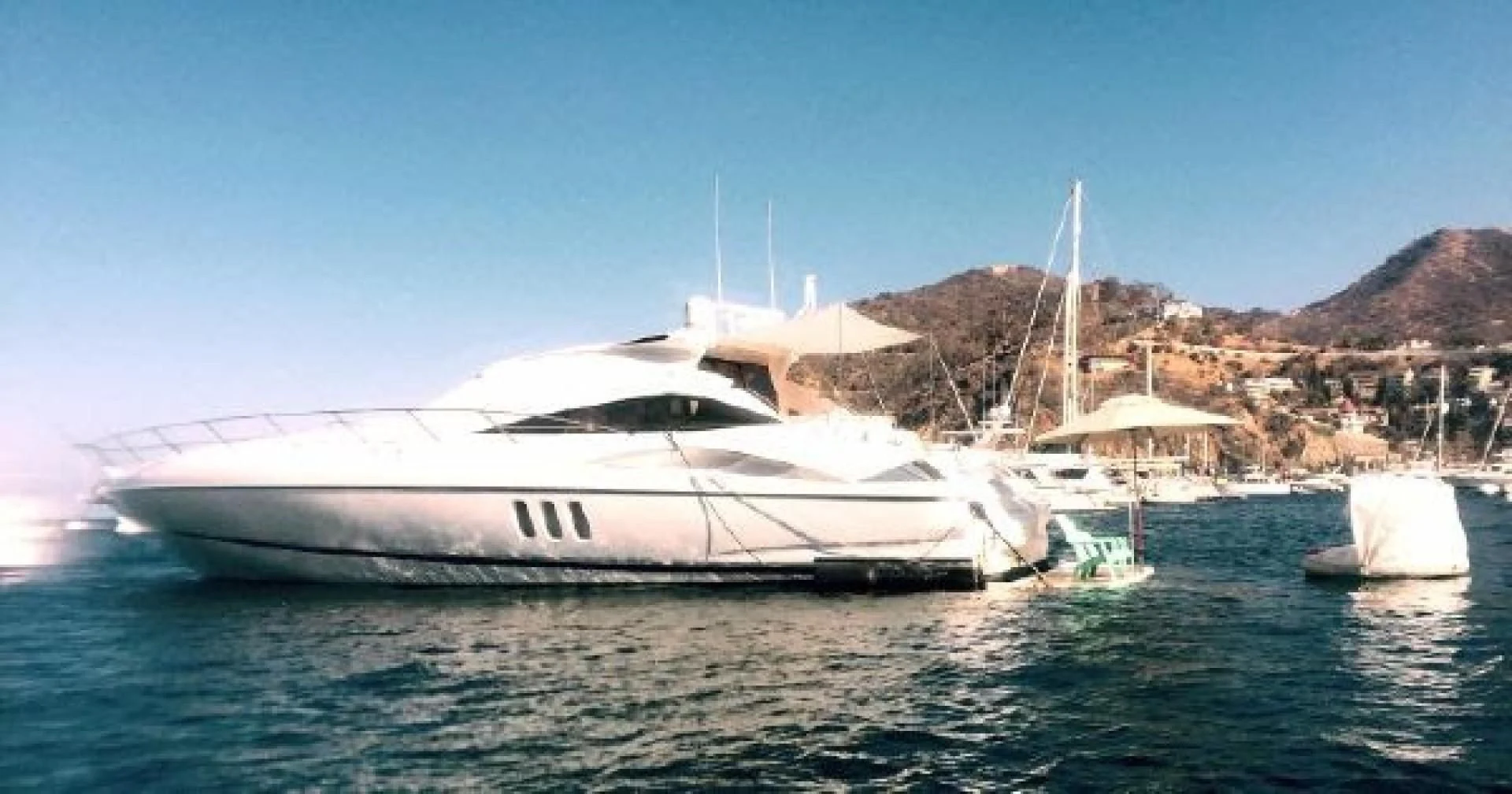 a white yacht in the water aboard SONSEEKER Yacht for Sale