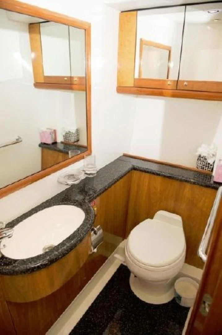 a bathroom with a sink and toilet aboard SONSEEKER Yacht for Sale