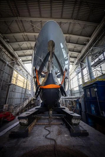 a large space shuttle in a warehouse aboard KATHRYN Yacht for Sale