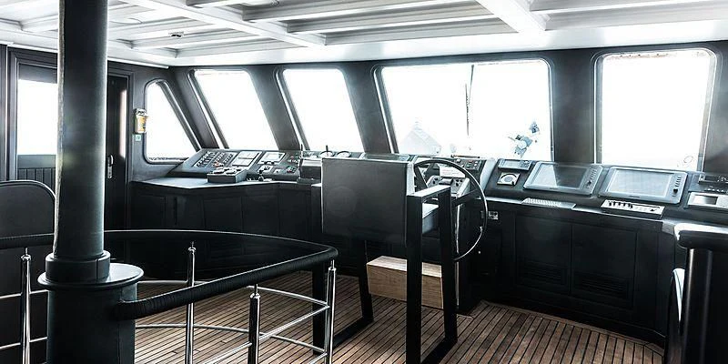 a black table in a bus aboard MENORCA Yacht for Sale