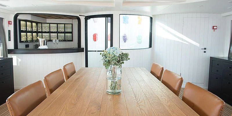 a vase of flowers on a table aboard MENORCA Yacht for Sale