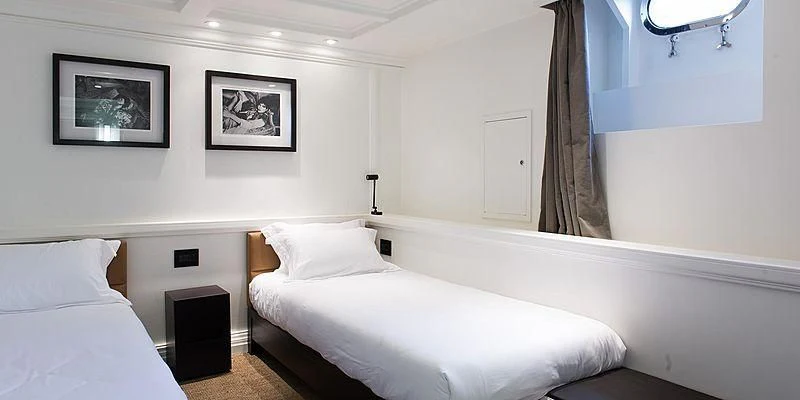 a room with two beds aboard MENORCA Yacht for Sale