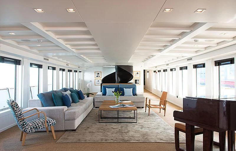 a living room with a large screen aboard MENORCA Yacht for Sale