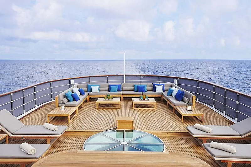 a deck with chairs and a pool aboard MENORCA Yacht for Sale