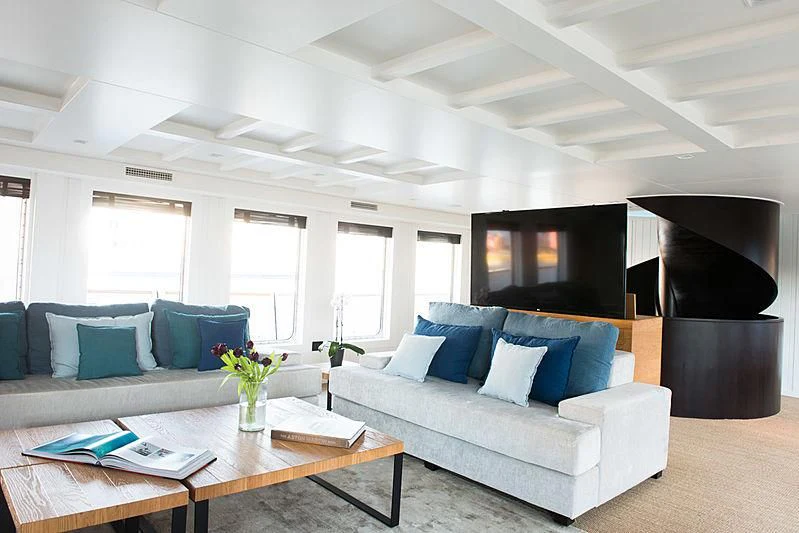 a living room with a couch and a coffee table aboard MENORCA Yacht for Sale