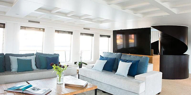 a living room with a couch and a tv aboard MENORCA Yacht for Sale