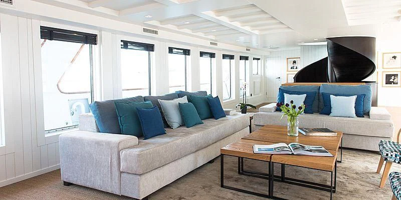 a living room with a couch and a coffee table aboard MENORCA Yacht for Sale