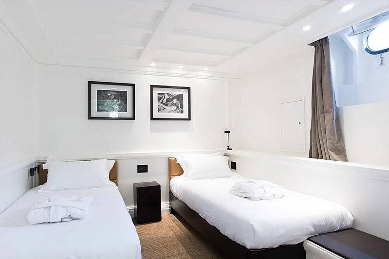 a room with two beds aboard MENORCA Yacht for Sale