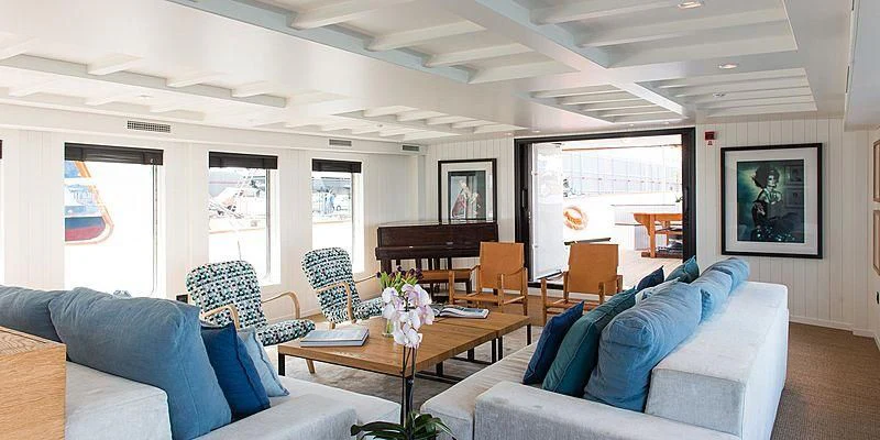 a living room with a piano aboard MENORCA Yacht for Sale