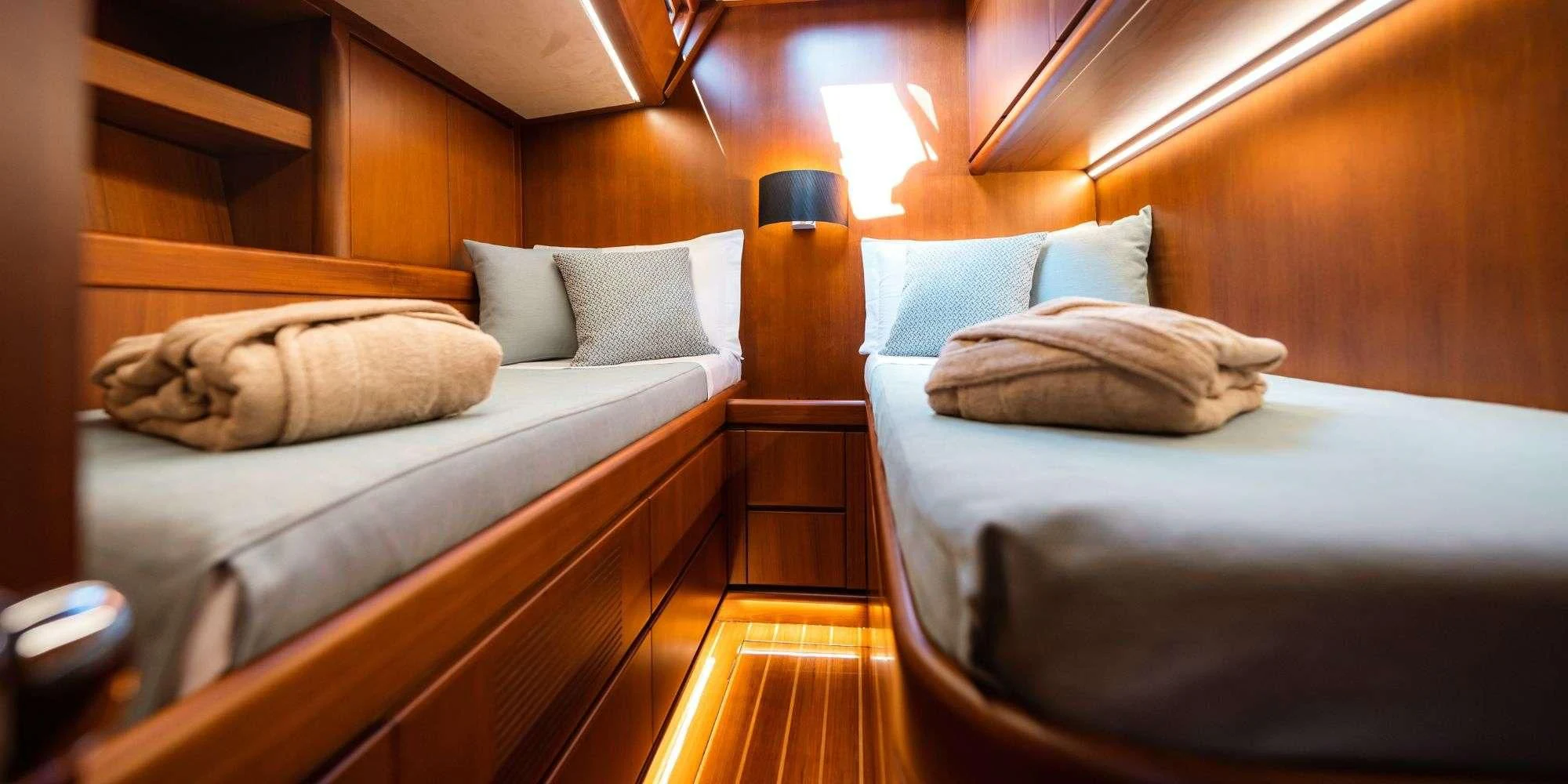 a couple of beds in a room aboard WALLY ONE Yacht for Sale
