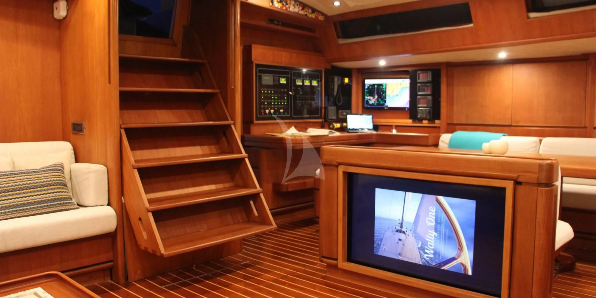 a room with a tv and a couch aboard WALLY ONE Yacht for Sale