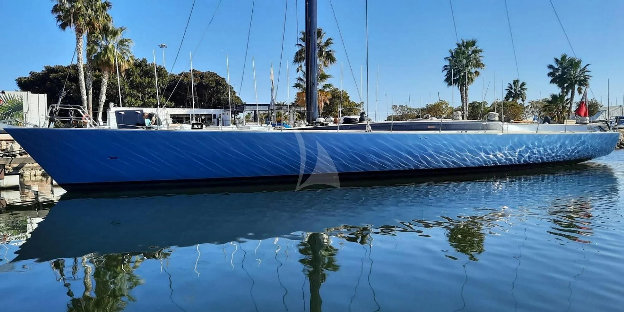 a large blue boat in a body of water aboard WALLY ONE Yacht for Sale