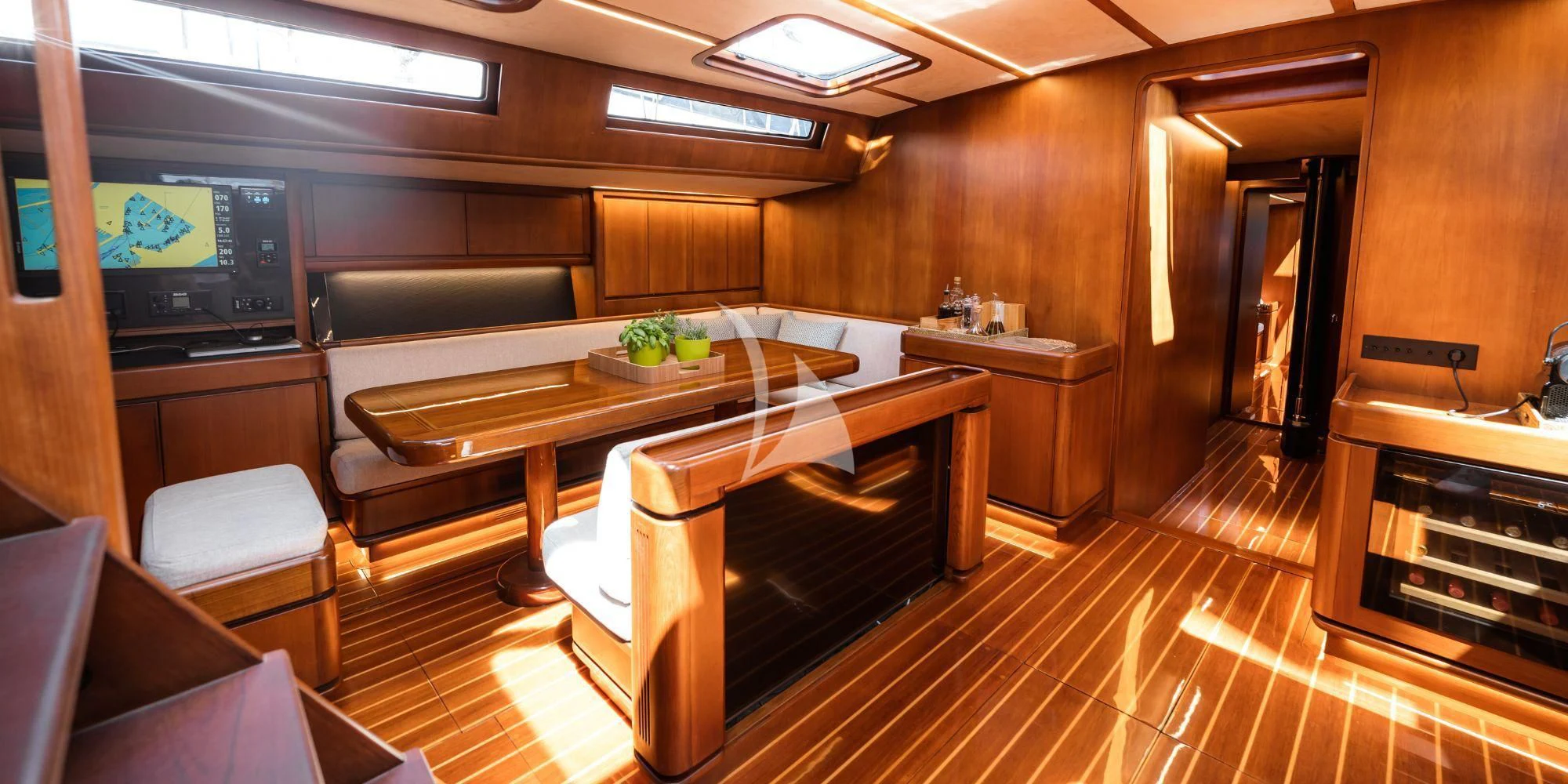 a kitchen with a table and chairs aboard WALLY ONE Yacht for Sale