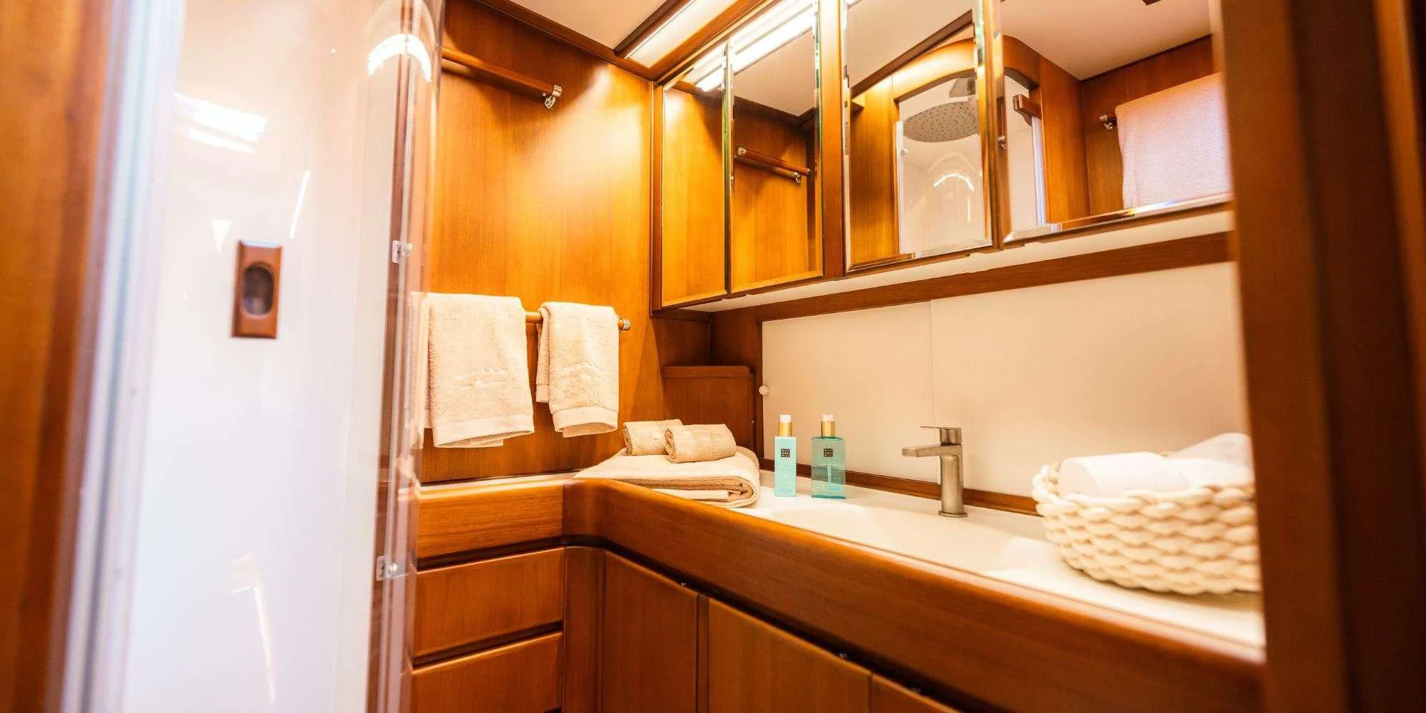 a bathroom with a large mirror aboard WALLY ONE Yacht for Sale