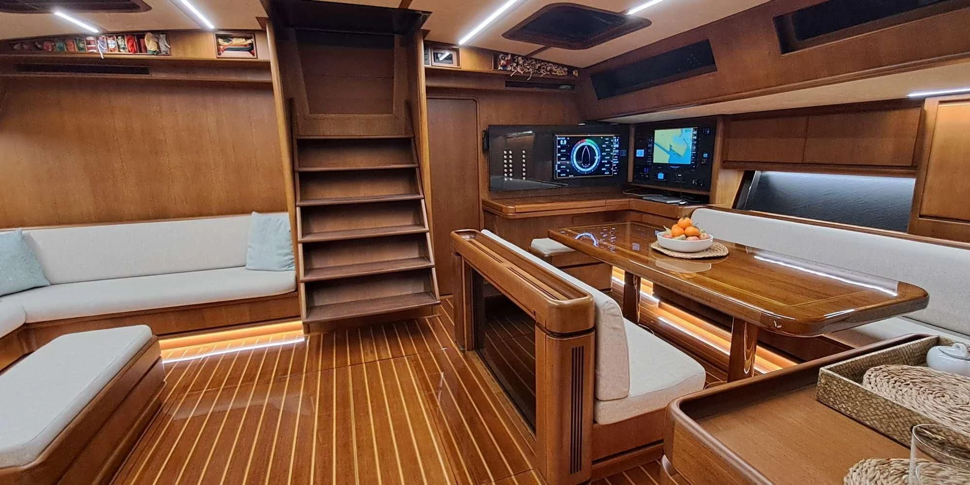 a room with a table and chairs aboard WALLY ONE Yacht for Sale