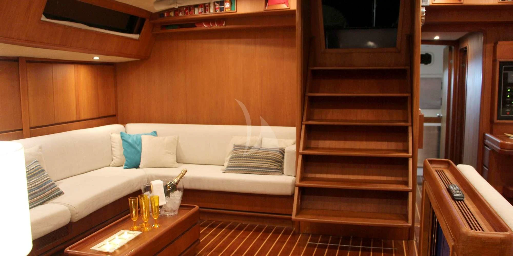 a living room with a couch and a table aboard WALLY ONE Yacht for Sale