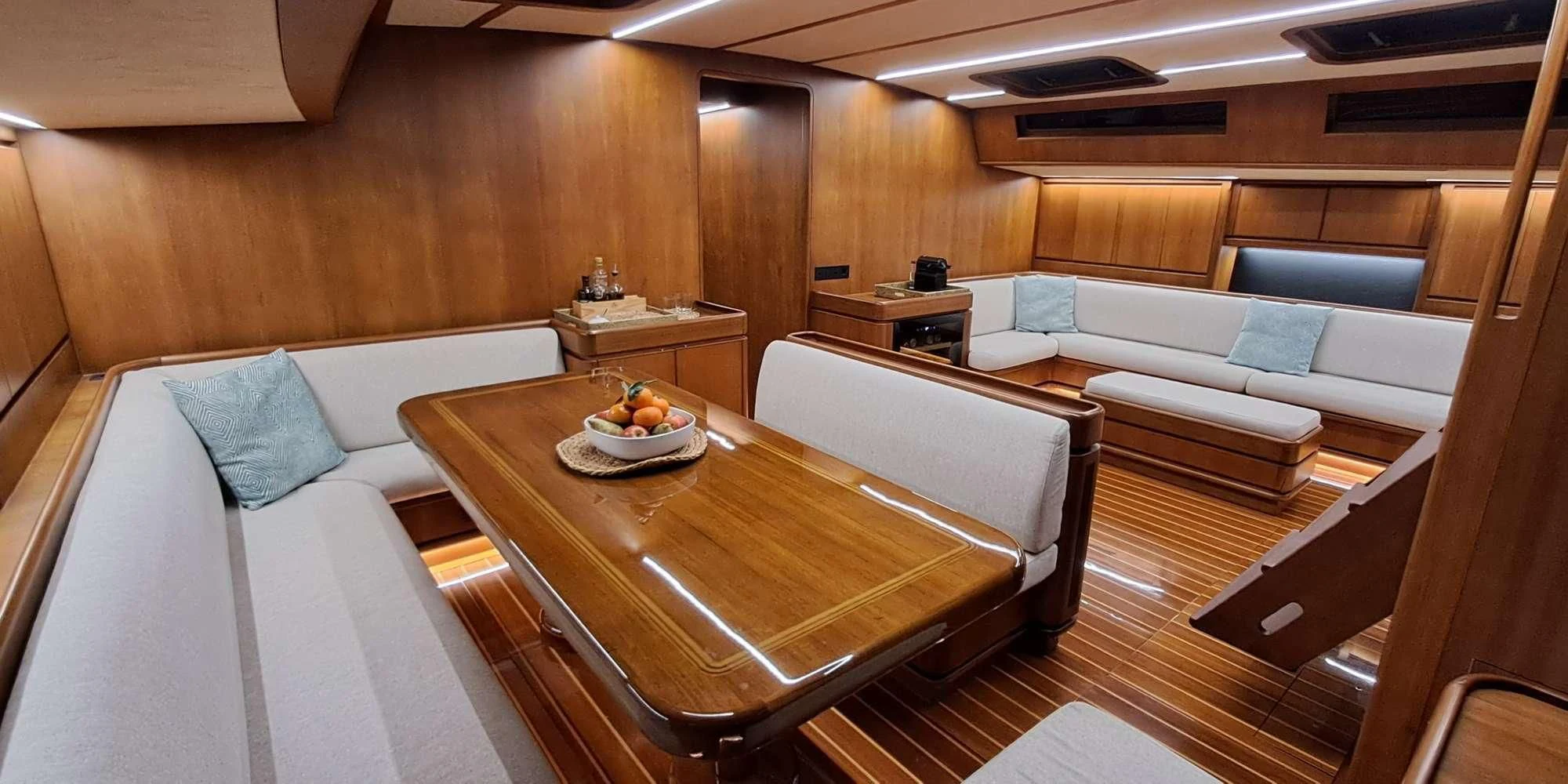 a room with a couch and a table aboard WALLY ONE Yacht for Sale