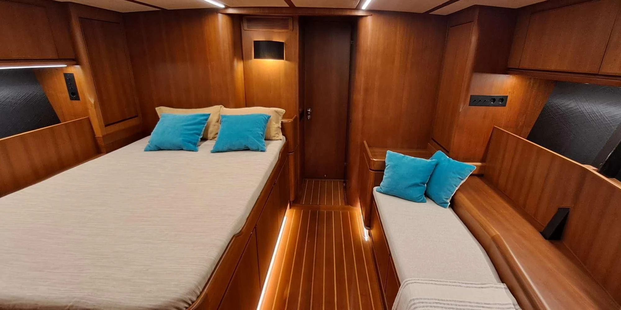 a room with a bed and a wood wall aboard WALLY ONE Yacht for Sale